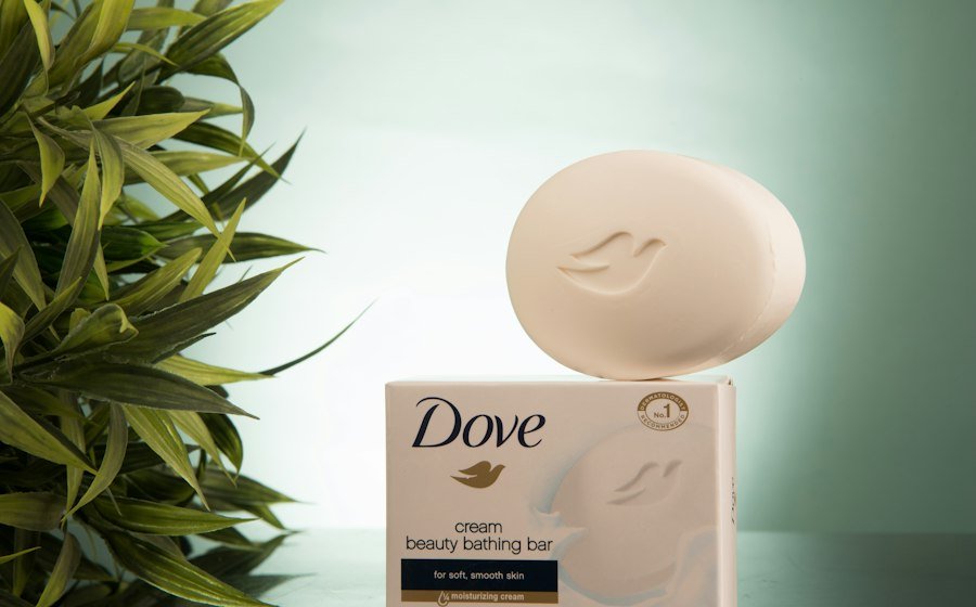 Dove beauty bathing bar on its box beside a green plant